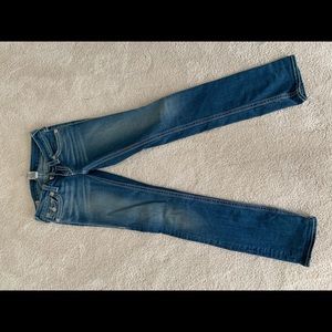 True religion light washed blue jeans.